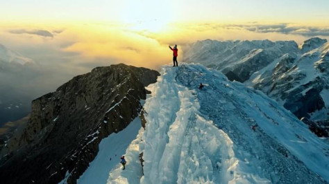 航拍雪山山峰山巅励志登山