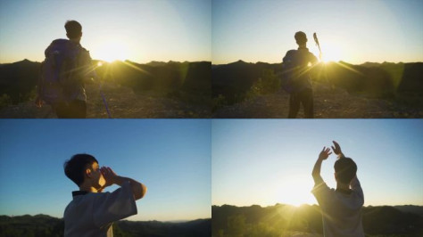 登山登顶庆祝欢呼呐喊举手跳跃夕阳阳光逆光