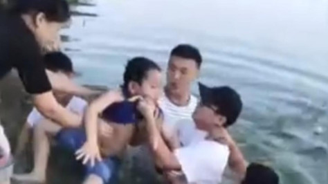 Boy rescued after falling into water in E China