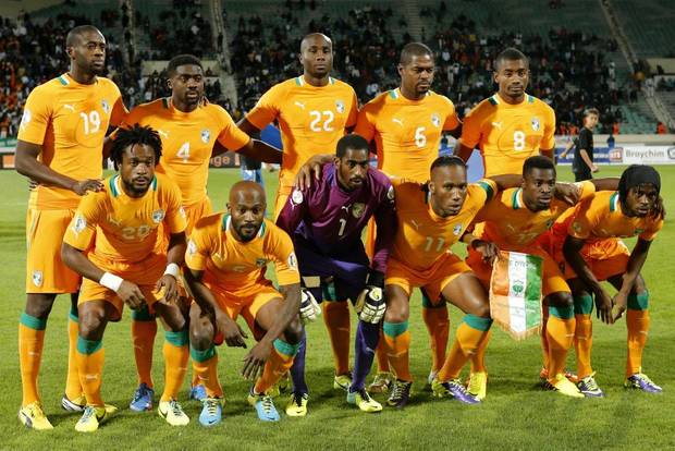 GROUP C - In this Nov. 16, 2013 file photo, Ivory Coast soccer team poses prior to the World Cup 2014 qualifying soccer match between Ivory Coast and Senegal. Background from left: Yaya Toure, Toure Kolo Abib, Souleman Bamba, Romaric N'Dri, and Salomon Kalou. Foreground from left: Gosso Jean-Jacques, Zokora Deguy, goalkeeper Barry Boubacar, Didier Drogba, Aurier Serge and Yao Kouassi Gervais. 