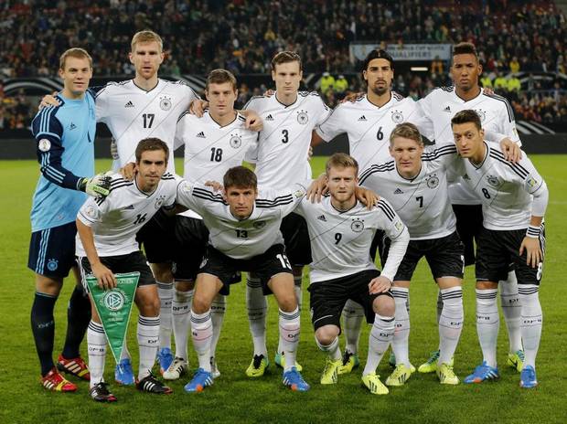 GROUP G - In this Oct 11, 2013 file photo, Germany soccer team poses prior to the start the World Cup Group C qualifying soccer match between Germany and Ireland. Background from left: Manuel Neuer, Per Mertesacker, Toni Kroos. Marcell Jansen, Sami Khedira and Jerome Boateng. Foreground from left: Philipp Lahm, Thomas Mueller, Andre Schuerrle, Bastian Schweinsteiger and Mesut Ozil. 