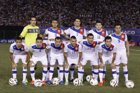 GROUP B - In this June 7, 2013 file photo, Chile team poses prior to the start the 2014 World Cup qualifying soccer match between Paraguay and Chile. Background from left: goalkeeper Claudio Bravo, Arturo Vidal, Marcos Gonzalez, Jose Rojas and Eduardo Vargas. Foreground from left: Alexis Sanchez, Mauricio Isla, Marcelo Diaz, Gary Medel, Esteban Paredes, and Eugenio Mena. 