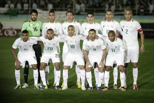 GROUP H - In this Nov. 19, 2013 file photo, Algeria's national soccer team poses prior to the start the World Cup qualifying soccer match between Burkina Faso and Algeria. Background from left: Mohamed Lamine Zemmamouche, Faouzi Ghoulam, Mehdi Mostefa-sbaa, Carl Medjani, Islam Slimani and Madjid Bougherra. Foreground from left: El Arbi Hillel Soudani, Nacereddine Khoualed, Sofiane Feghouli, Medhi Lacen, Yacine Brahimi.