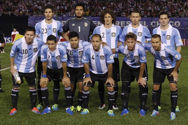 GROUP F - In this Sept. 10, 2013 file photo, Argentina soccer team poses prior to the start the World Cup qualifying soccer match between Argentina and Paraguay. Background from left: Jose Basanta, Sergio Romero, Fabricio Coloccini, Hugo Campagnaro and Fernando Gago. Foreground from left: Lionel Messi, Angel Di Maria, Sergio Aguero, Pablo Zabaleta, Lucas Biglia and Rodrigo Palacio. 