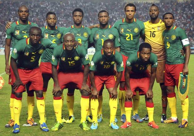 GROUP A - In this Oct. 13, 2013 file photo, Cameroon soccer team poses prior to the start the World Cup qualifying soccer between Tunisia and Cameroon. Foreground from left: Tchounko Nounke, Kouamo Webo, Takang Enouh Eyong and Jean Makoun. Background from left: Allan Romeo Nyom, Bilong Song, Ndoubena Nkoulou, Fongang Chedjou, Job Mtip Joel and Samuel Etoo. 