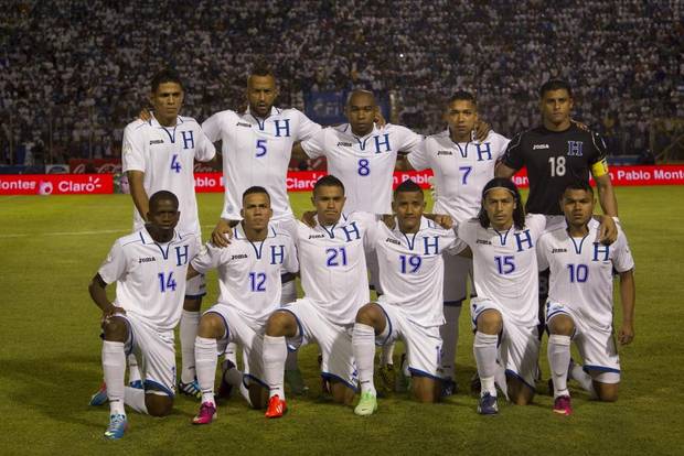 GROUP E - In this June 11, 2013 file photo, Honduras national soccer team poses prior to the start the 2014 World Cup qualifying soccer match between Honduras and Jamaica. Background from left: Juan Montes, Victor Bernardez, Wilson Palacios, Emilio Izaguirre and Noel Valladares. Foreground from left: Oscar Garcia, Arnold Peralta, Roger Rojas, Luis Garrido, Roger Espinoza and Mario Martinez.