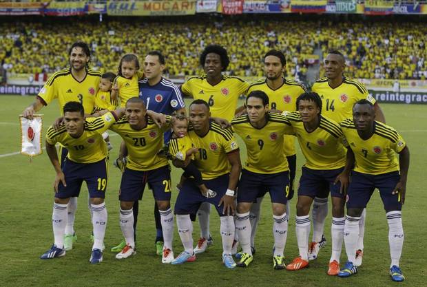 GROUP C - In this June 11, 2013 file photo, Colombia soccer national team pose prior to a 2014 World Cup qualifying match against Peru. Background from left: Mario Yepes, David Ospina, Carlos Sanchez, Abel Aguilar and Luis Perea. Foreground from left: Teofilo Gutierrez, Macnelly Torres, Camilo Zuniga, Radamel Falcao Garcia, Juan Cuadrado and Pablo Armero.