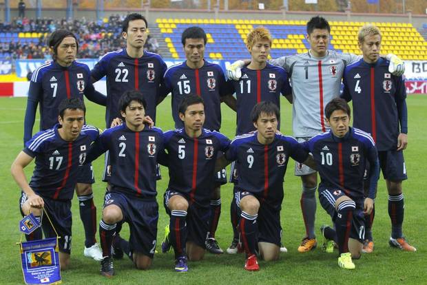 GROUP C - In this Oct. 15, 2013 file photo, Japan soccer team poses prior to the start their friendly soccer match against Belarus. Background from left: Yasuhito Endo, Maya Yoshida,Yasuyuki Konno, Yoichiro Kakitani, Eiji Kawashima and Keisuke Honda. Foreground from left: Makoto Hasebe, Atsuto Uchida, Yuto Nagatomo, Shinji Okazaki and Shinji Kagawa. 