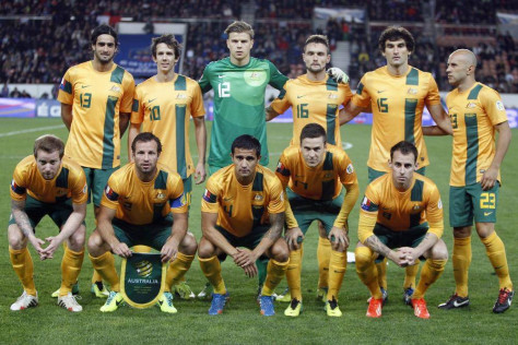 GROUP B - In this Oct. 11, 2013 file photo, Australia soccer team poses prior to the start their international soccer friendly match between France and Australia. Background from left: Rhys Williams, Robbie Kruse, Mitchell Langerak, James Holland, Mile Jedinak and Mark Bresciano. Foreground from left: David Carney, Lucas Neill, Tim Cahill, Matty McKay and Luke Wilkshire. 