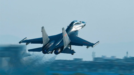 Fighter jet takes off at night