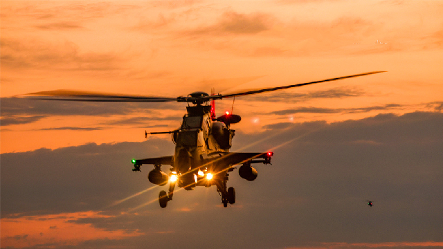 Attack helicopter lifts off for flight training